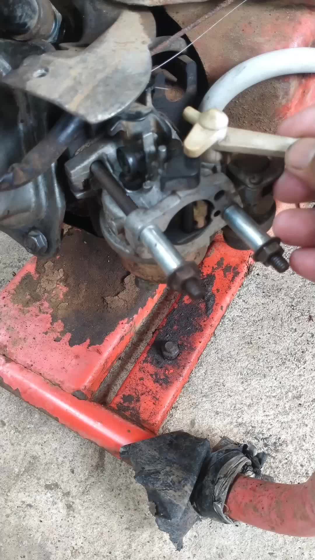 Repairing the carburetor of a water pump engine