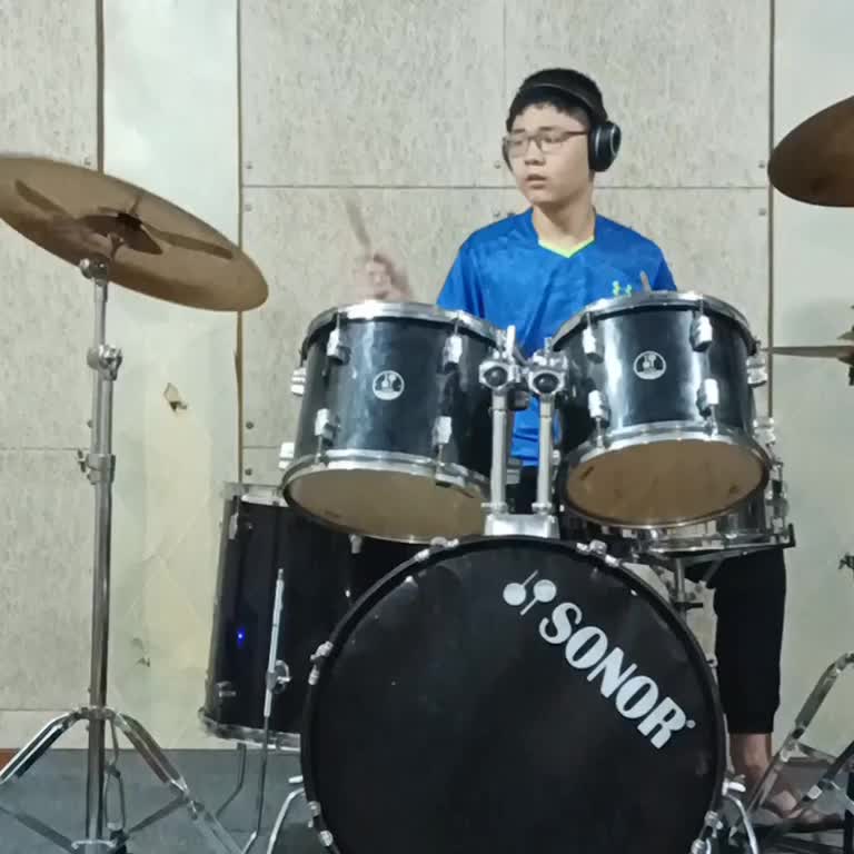 Kenzo is practicing drums