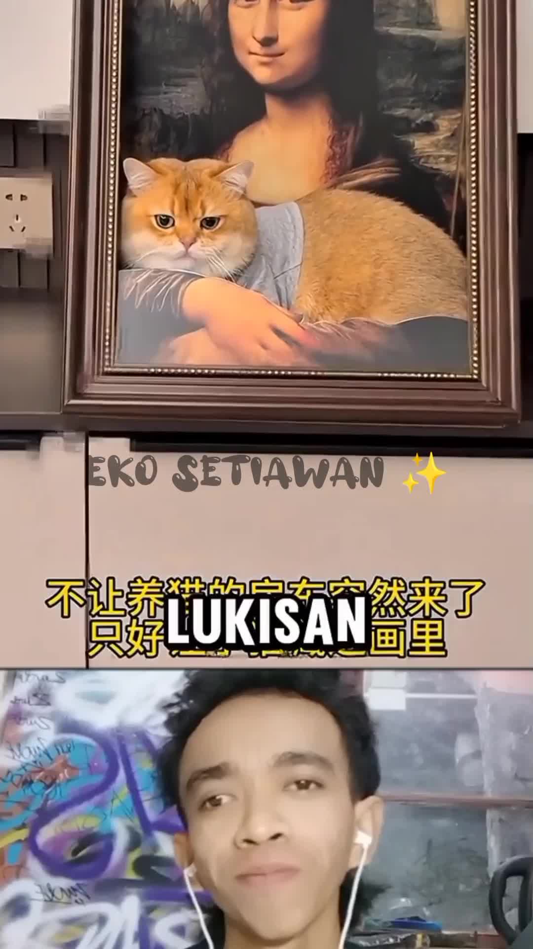 kucing ini menyamar jadi lukisan ?????